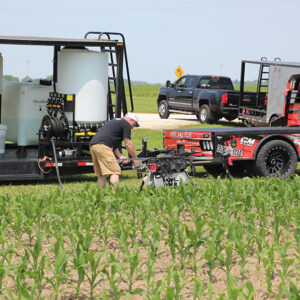 agricultural drone and trailer in corn field