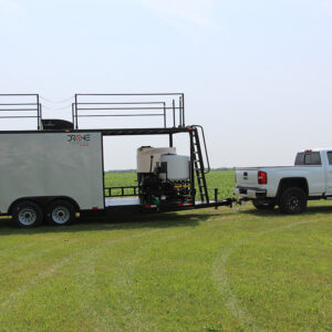 agricultural drone trailer being pulled on farm road 2