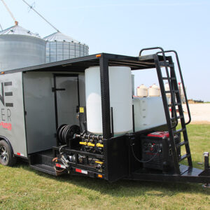 agricultural drone trailer in front of silos